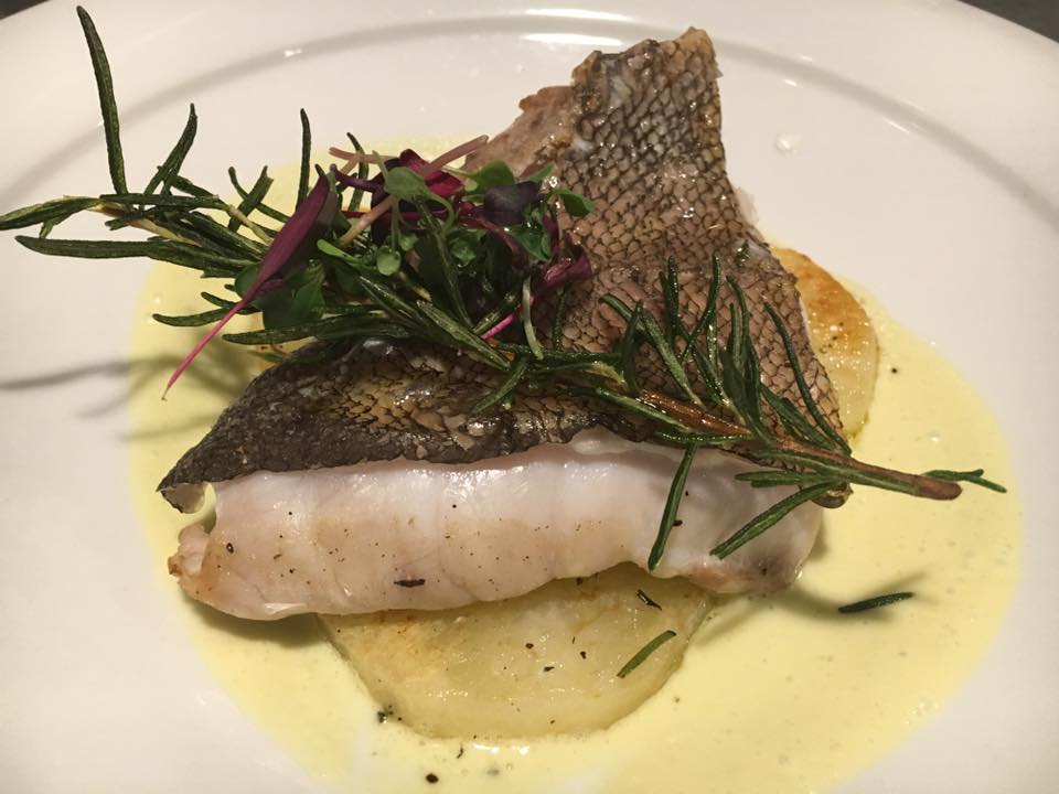 Roasted grouper filet with rosemary potatoes and lemon-clam emulsion