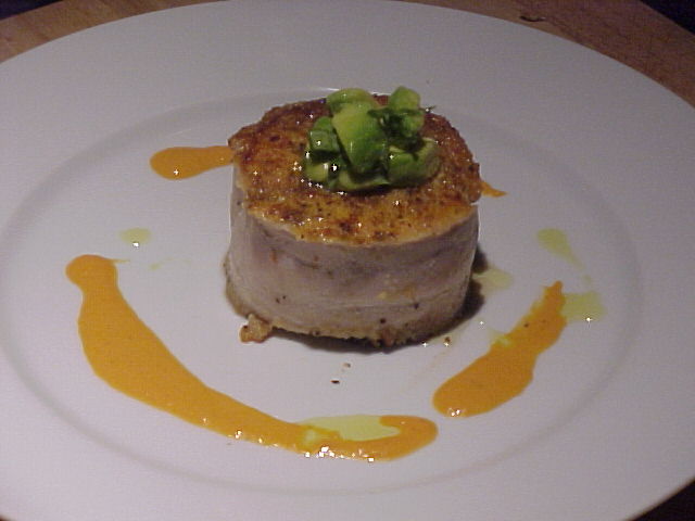 Baked Mahi Mahi with roasted bell pepper sauce and avocado garnish