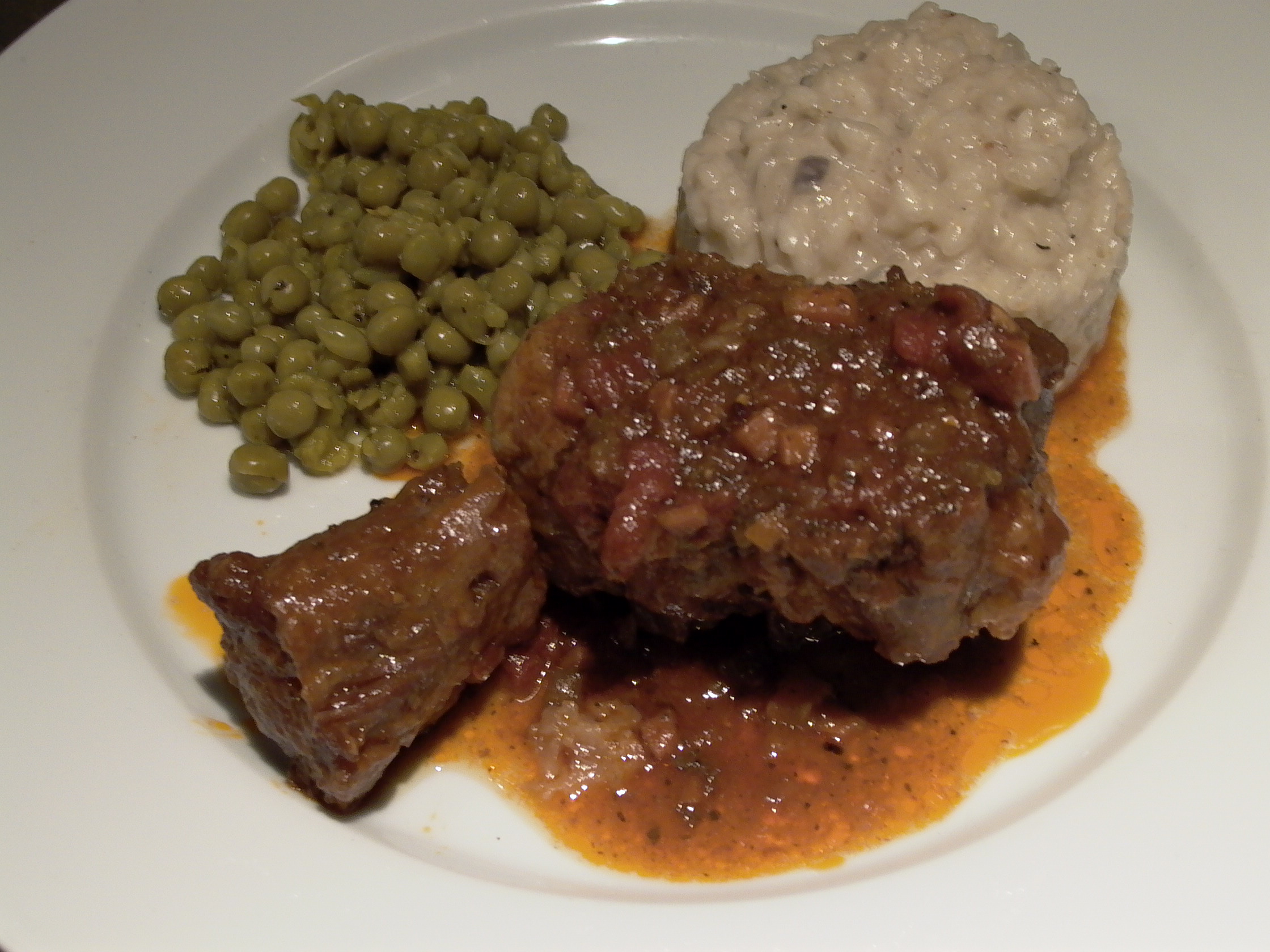 Tuscan braised beef oxtail with peas and rice pilaf