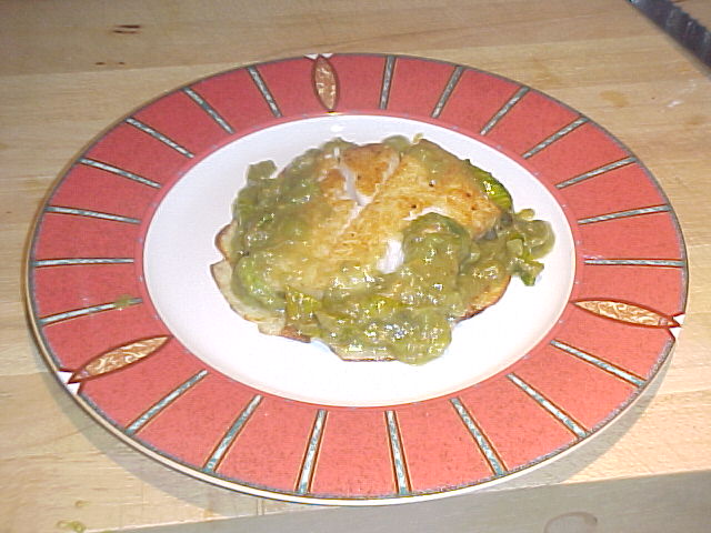 Turbot Filet Rombo with butter-baked potatoes and green tomato anchovy sauce