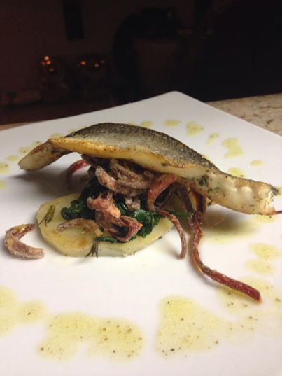Pan roasted branzino filet with crispy skin, peppers carpione, spinach, and butter potatoes