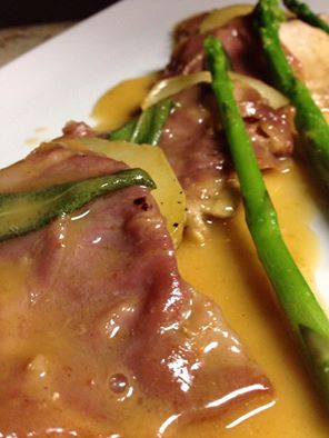 Veal Saltimbocca with prosciutto, sage, baked potatoes, and asparagus