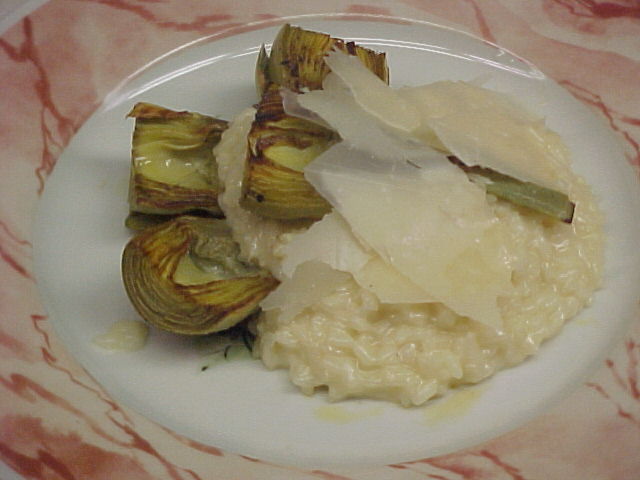 Parmesan cheese risotto topped with grilled baby artichokes