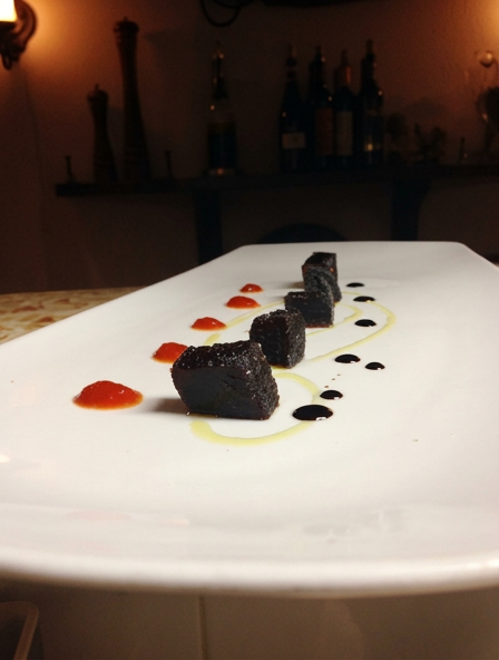Balsamic jelly cubes served with silky red bell pepper fondue