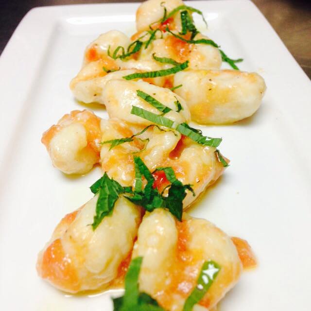 Ricotta gnocchi with tomatoes and mint oil