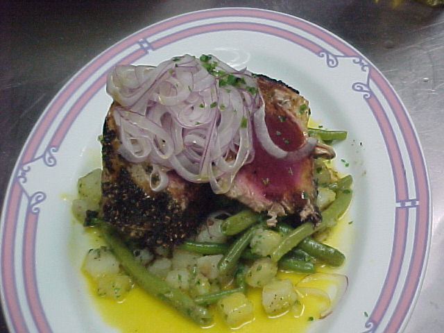 Seared Ahi tuna with green beans, potatoes, marinated red onions, and lemon citronette
