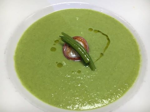 Green haricot vert soup with prosciutto-wrapped scallops